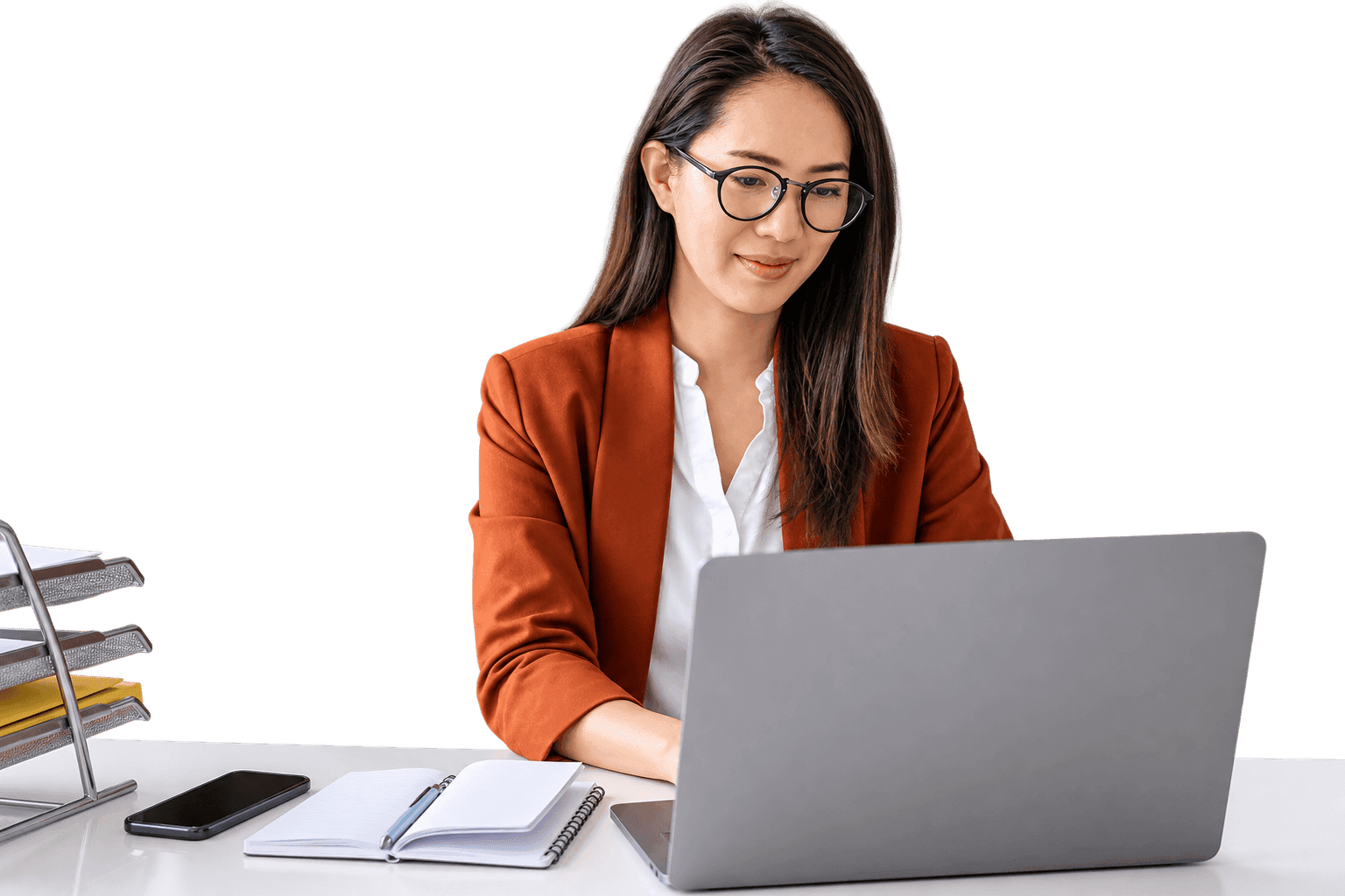 Small-business owner typing an email on a laptop
